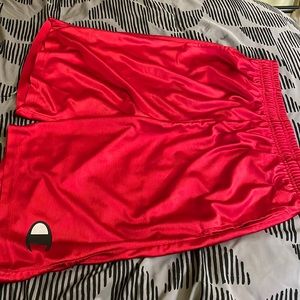 Shiny red champion basketball shorts